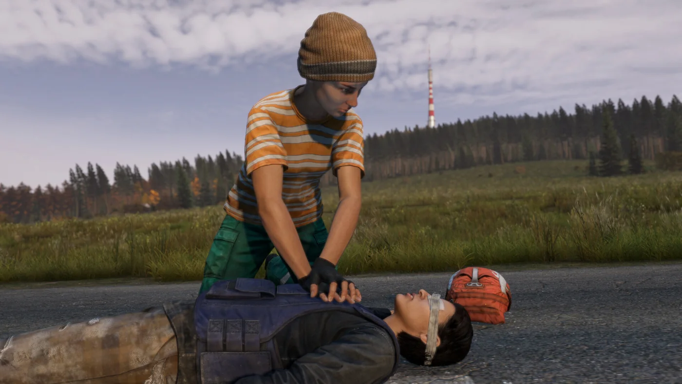 DayZ survivor giving CPR on a Chernarus road